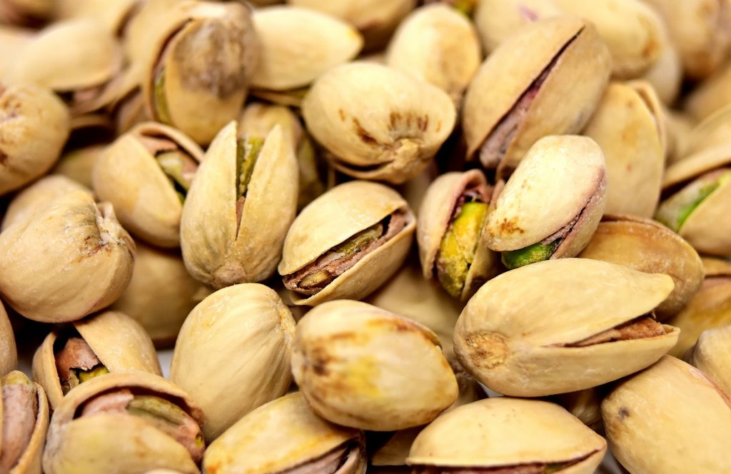 Shelled pistachios in a pile.