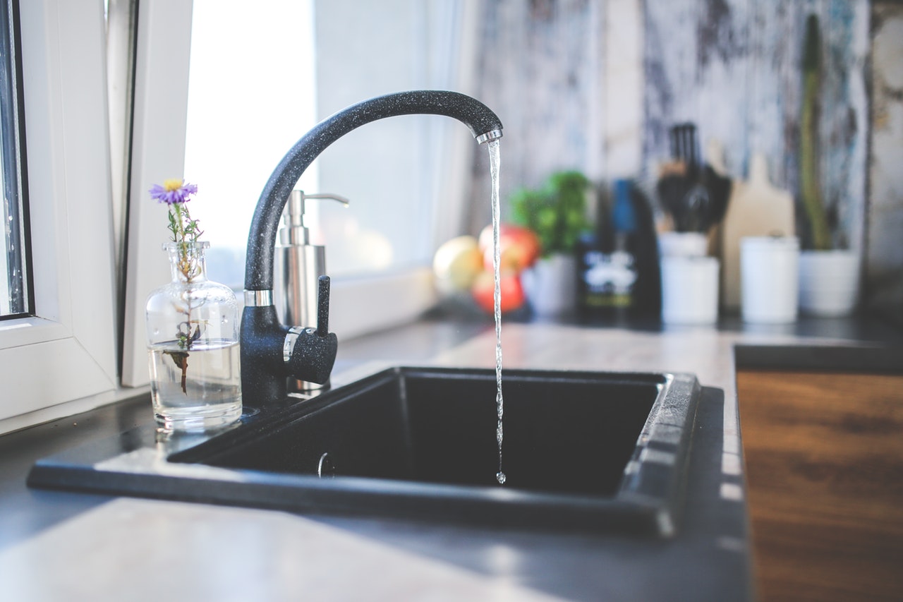 Kitchen sink with running water.