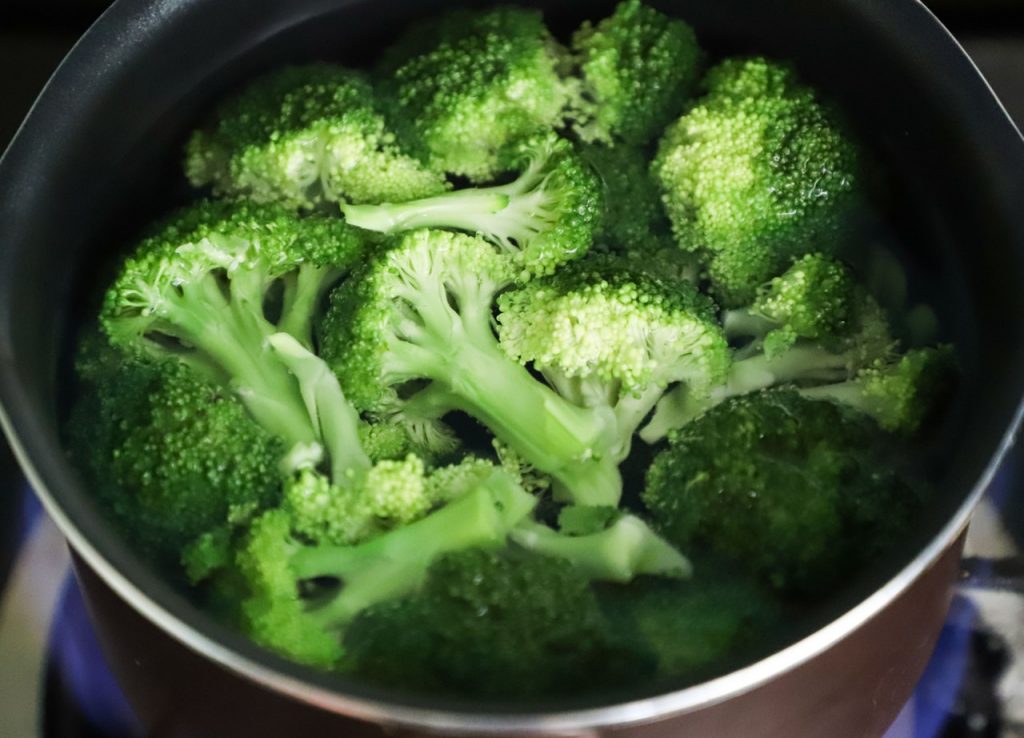 Broccoli boiling in a pan.