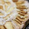 Apple galette sprinkled with confectioners sugar.