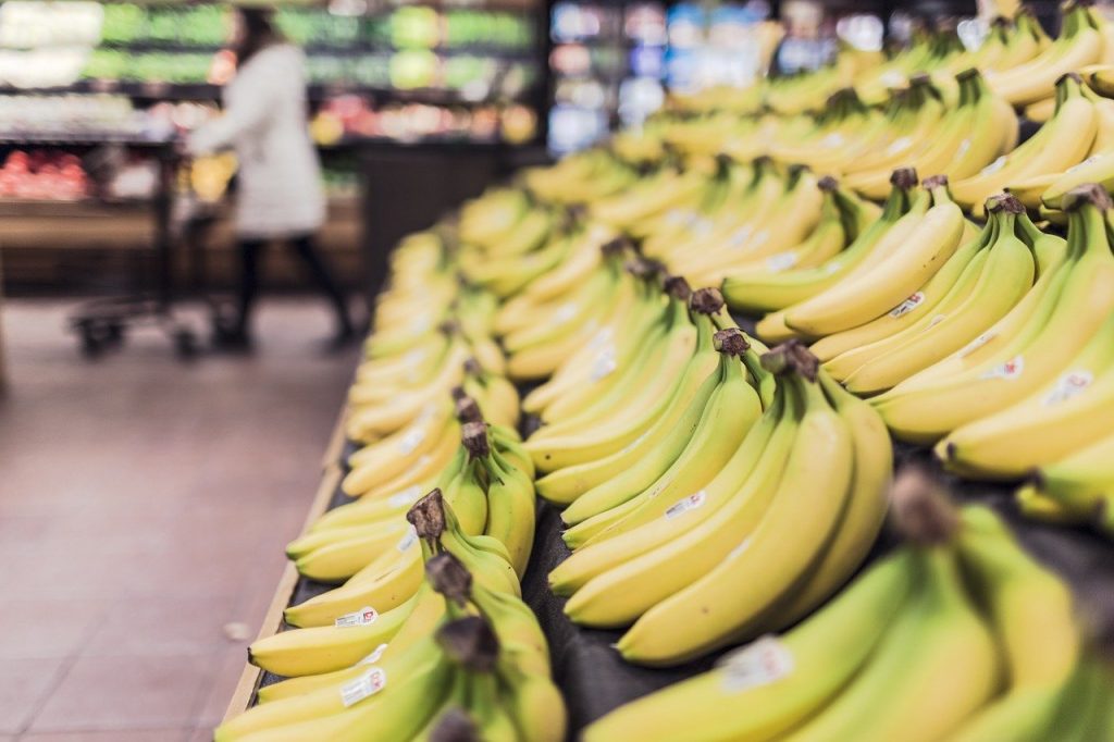 Row of bananas in grocery store.